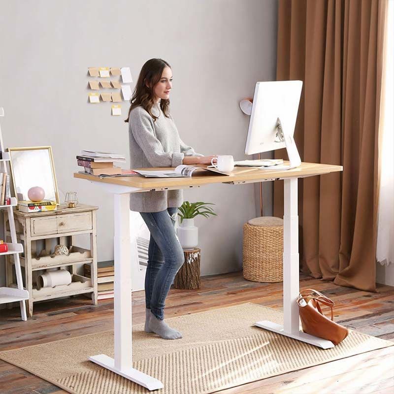 girl working on a standing desk at home