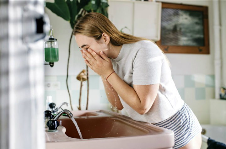 woman-washing-face-face cleanser