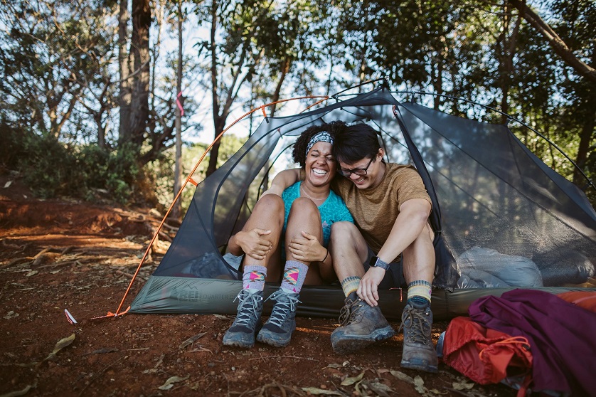 couple enjoying time in a hiking tent 