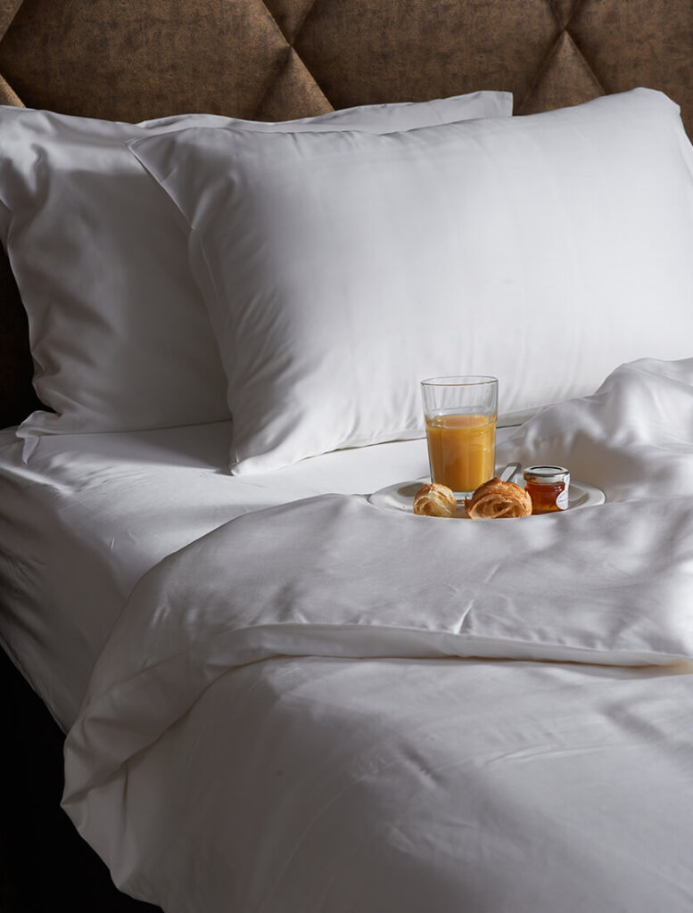 white bamboo sheets with breakfast on the bed