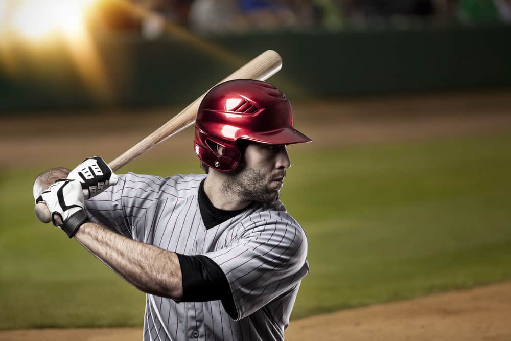 Man wearing baseball helmet while playing baseball