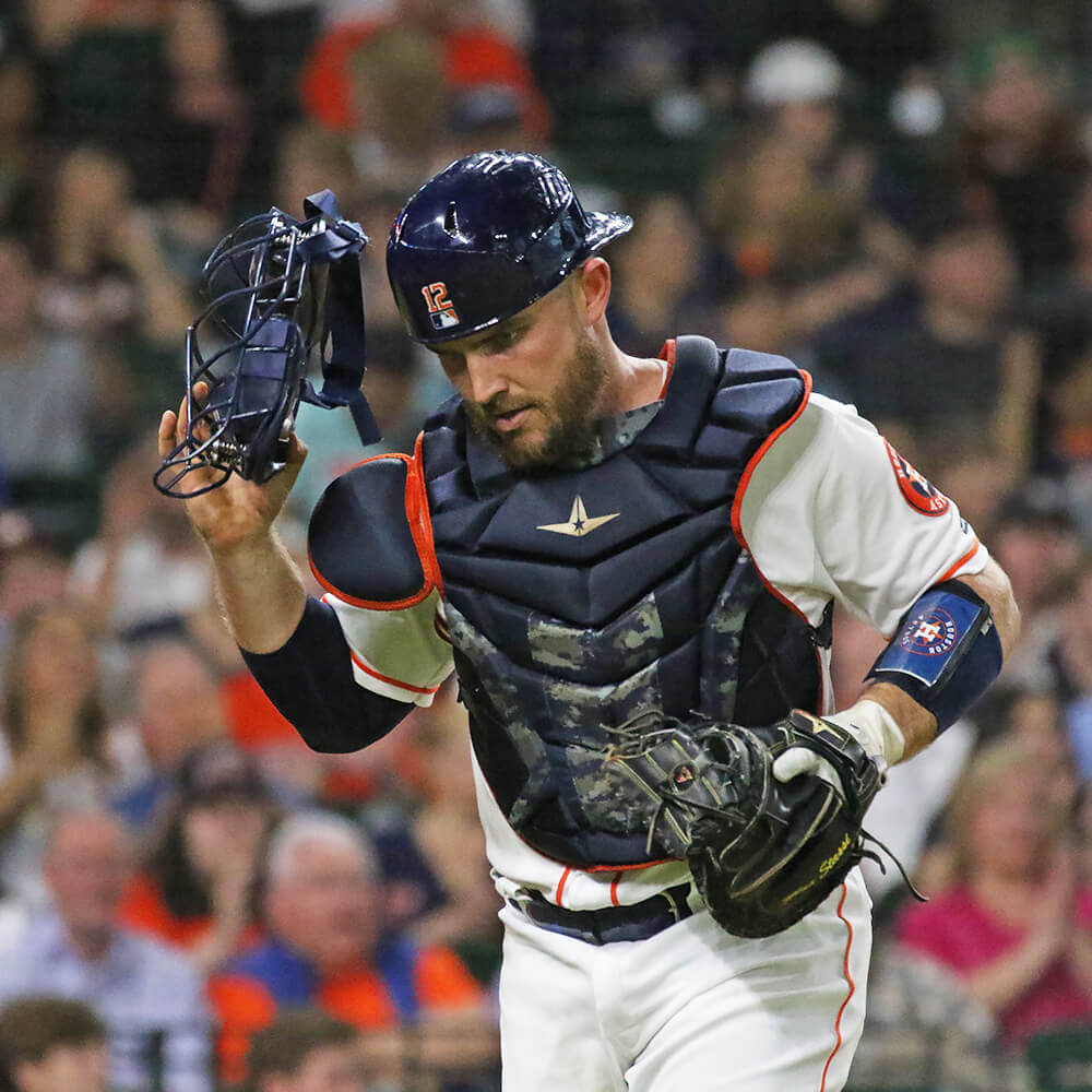 Man wearing Chest Protector in a baseball game