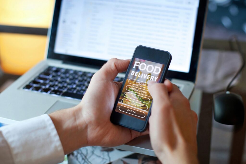 Photo of person ordering online food on phone