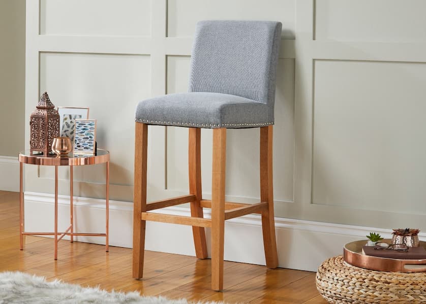 wooden stool bar with a fabric seat