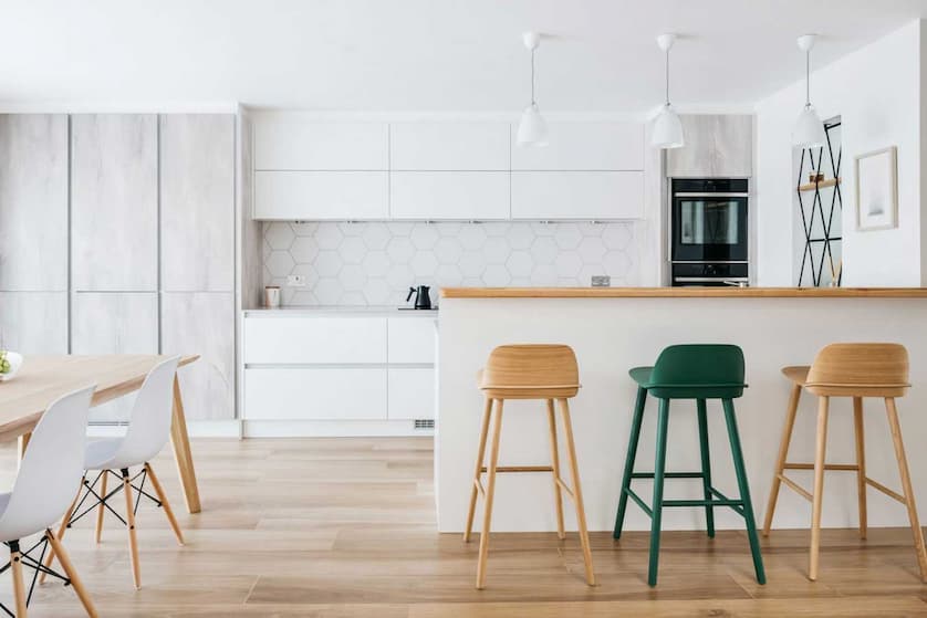 Scandinavian style kitchen with wooden bar stools