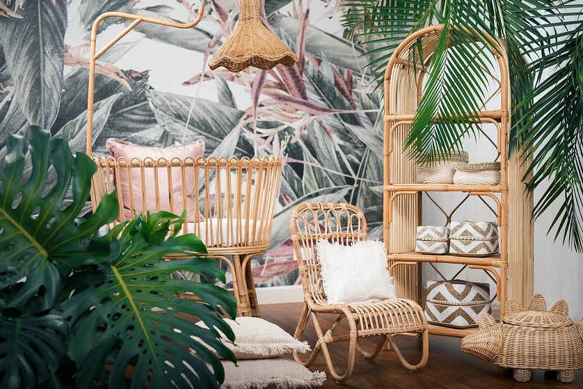 plants and Tropical Rattan Furniture in front of tropical wallpaper 