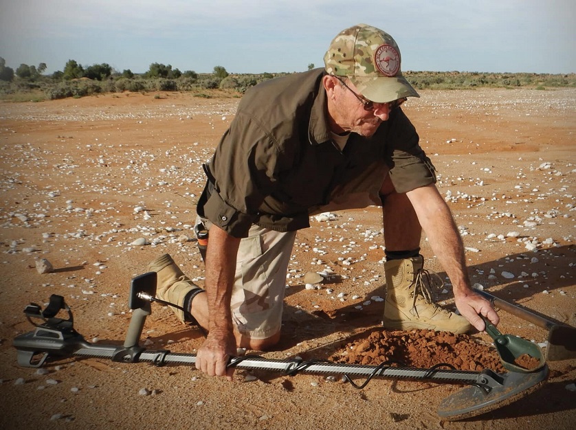 Man prospecting gold in desert