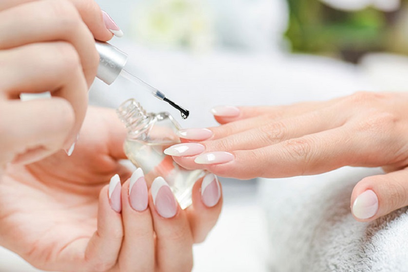 nail technician doing other woman's nails