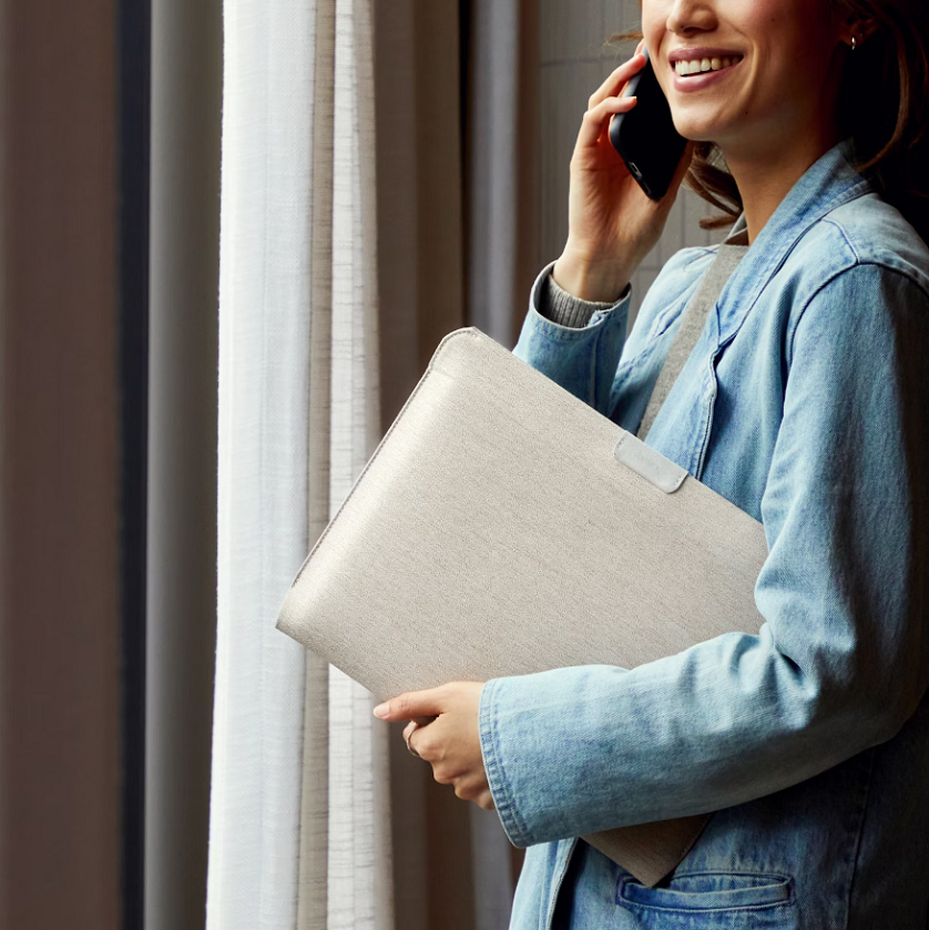 woman holding a laptop sleeve