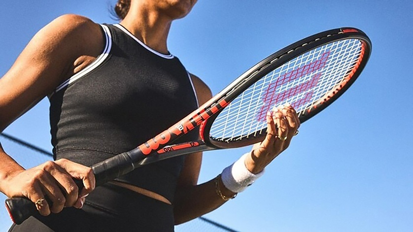 woman holding tennis racquet